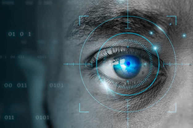 Close-up of a human eye with digital scanning elements, symbolizing biometric technology and data security. Binary code in background.
